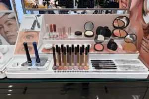 White Acrylic Countertop Display Tray Holding It Cosmetics Makeup Products In A Department Store