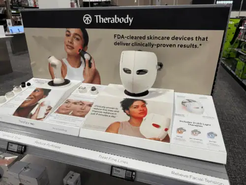 Acrylic Counter Display Presenting Therabody Skincare Devices With Printed Product Graphics