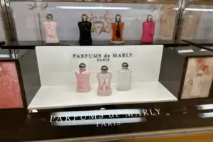 Acrylic Riser With Printed Panels Displaying Parfums De Marly Fragrances In A Lighted Case