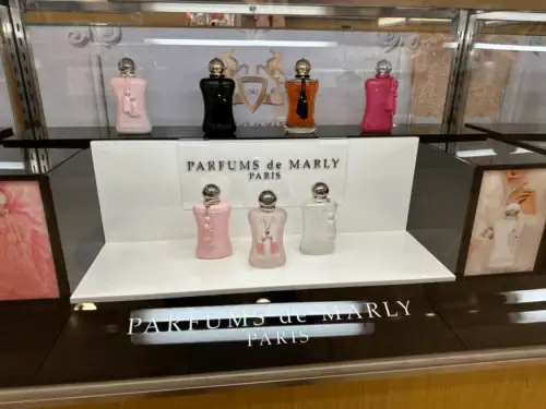 Acrylic Riser With Printed Panels Displaying Parfums De Marly Fragrances in a Lighted Case