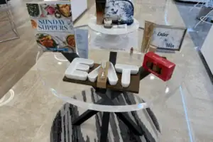 Round Clear Acrylic Table Display With Decorative Letters And Retail Signage