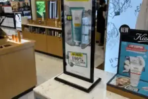Lighted Kiehl’s Brand Tower With Graphic Panels In A Department Store Cosmetics Area