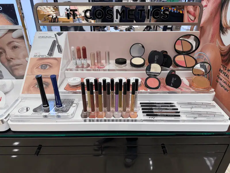 Custom Cosmetic Retail Display Manufactured by All Source+ Featuring Acrylic Product Displays, Branded Graphics, and Premium Merchandising for a Beauty Retail Environment. Custom Cosmetic Retail Display Manufactured by All Source+ Featuring Acrylic Product Displays, Branded Graphics, and Premium Merchandising for a Beauty Retail Environment.