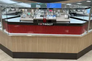 Custom Watch Counter With Wood-Look Panels, Glass Showcase And Tissot Branding