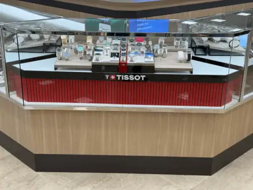 Custom Watch Counter With Wood-Look Panels, Glass Showcase and Tissot Branding