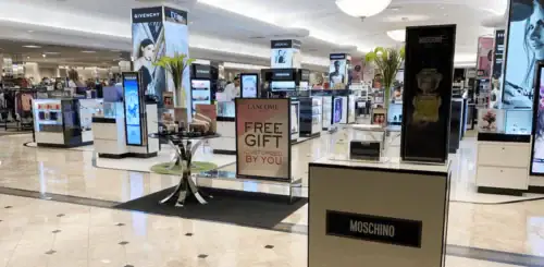 Freestanding Digital Display Towers and Fragrance Fixtures Across a Store Floor