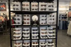Freestanding Eyewear Floor Display With Tiered Shelves Of Guess Sunglasses