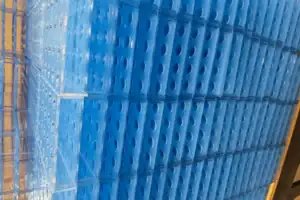 Stacked CNC-Fabricated Blue Plastic Components In Production