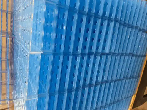 Stacked CNC-Fabricated Blue Plastic Components in Production