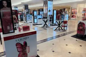 Fragrance Launch Area With Branded Counter Displays And Digital Towers