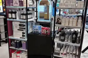 Lighted Haircare Brand Tower With Product Shelves And Graphic Side Panels