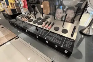 Cosmetics Testing Station With Acrylic Product Wells, Brushes And Numbered Makeup Stations