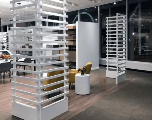 White Metal Accent Wall Fixtures and Display Towers in a Retail Store