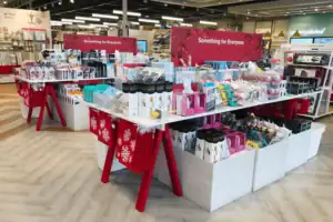 Store Interior With Custom Metal, Plastic And Wood Fixtures And Sawhorse Display Tables