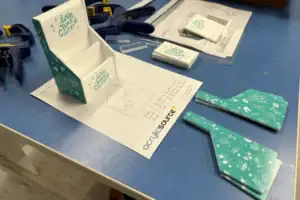 Point-of-Purchase Display Prototype And Templates On A Fabrication Workbench