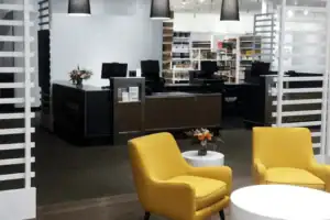 Retail Lounge Area With Modern Seating Beside White Custom Display Towers