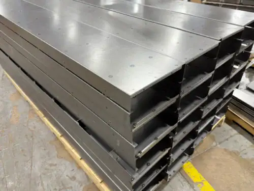 Fabricated Sheet Metal Trays Stacked for Finishing in the Metal Shop
