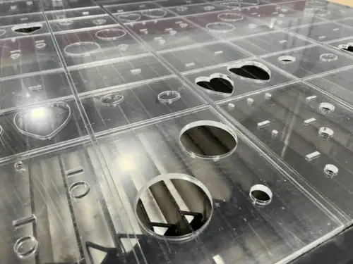 Detail of Turret-Punched Sheet Metal With Precision Cutouts and Formed Holes